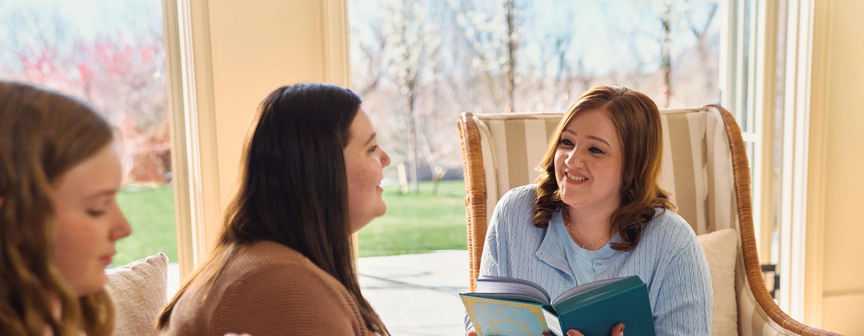 Real EKTERLY® (sebetralstat) patient Mistie enjoying her conversation with her daughters