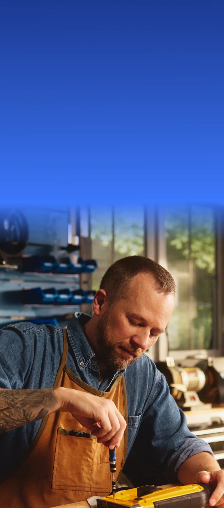Real EKTERLY® (sebetralstat) patient Jason peacefully tightening a tool in his workshop