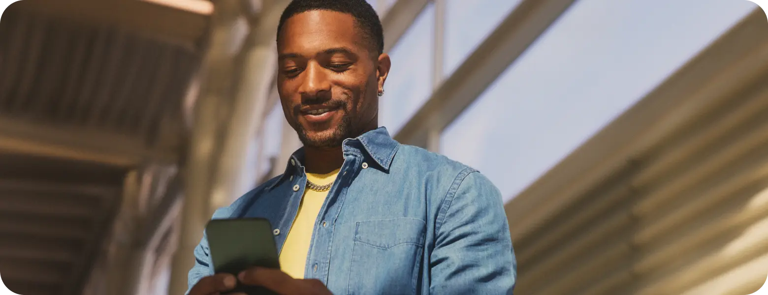 Hypothetical EKTERLY® (sebetralstat) patient looking at smartphone