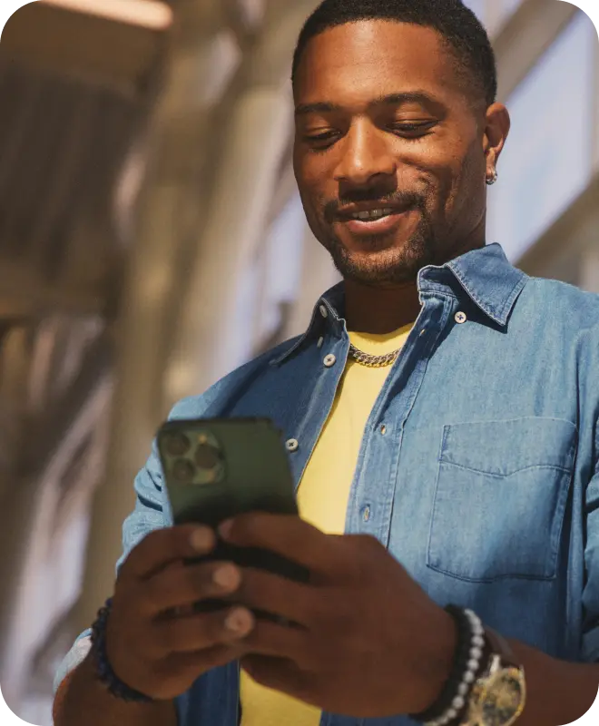 Hypothetical EKTERLY® (sebetralstat) patient looking at smartphone