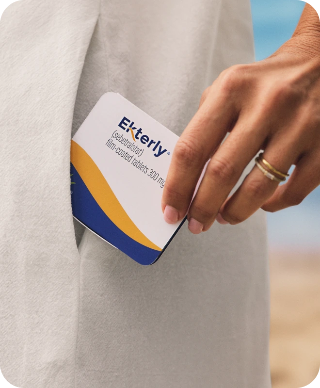 Hand holding EKTERLY® (sebetralstat) medication