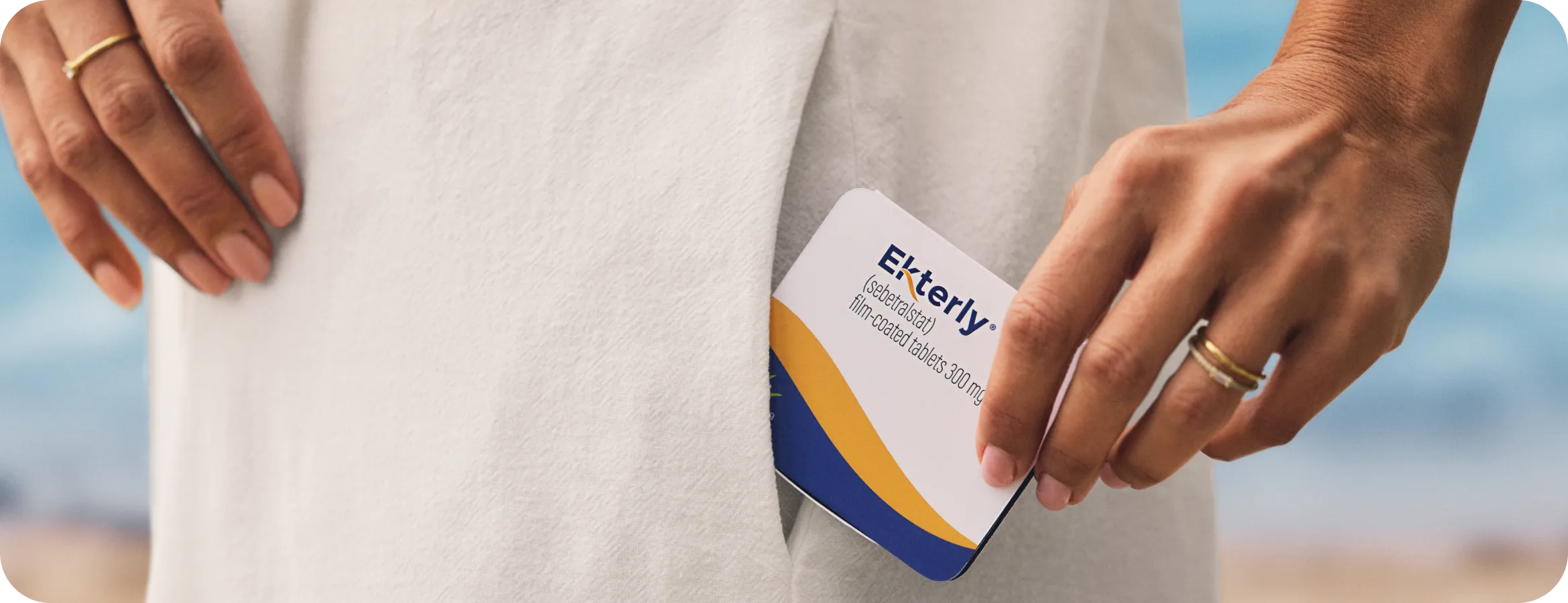 Hand holding EKTERLY® (sebetralstat) medication