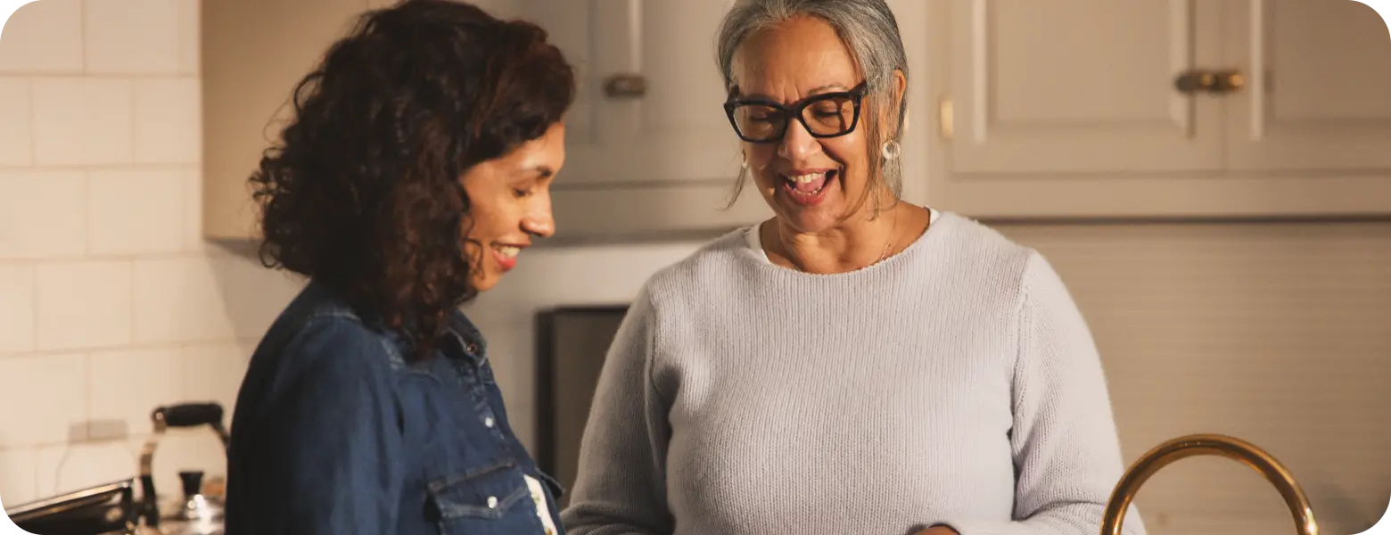 Hypothetical EKTERLY® (sebetralstat) patient socializing in the kitchen