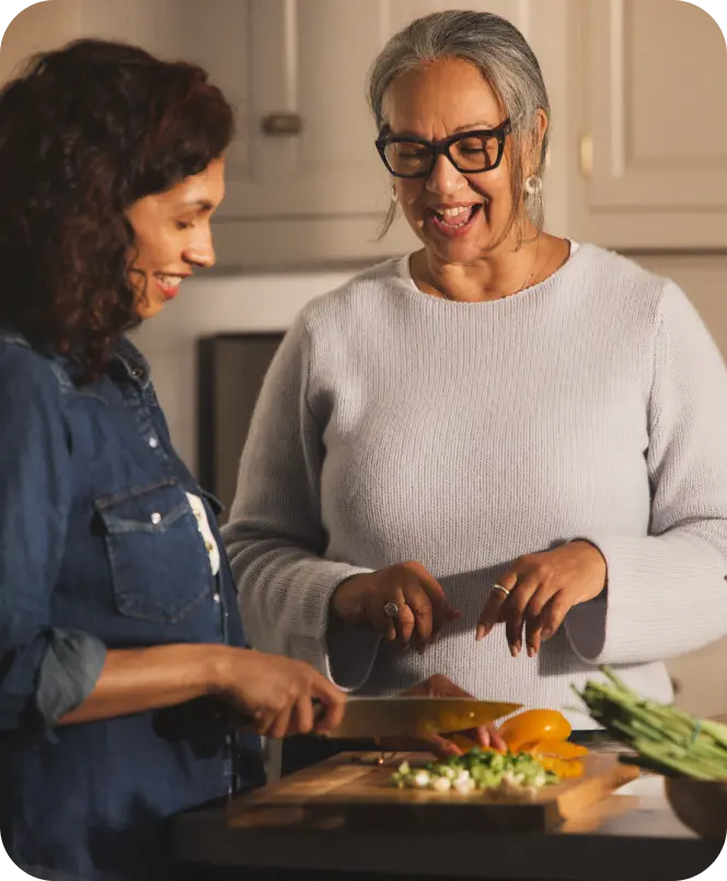 Hypothetical EKTERLY® (sebetralstat) patient socializing in the kitchen